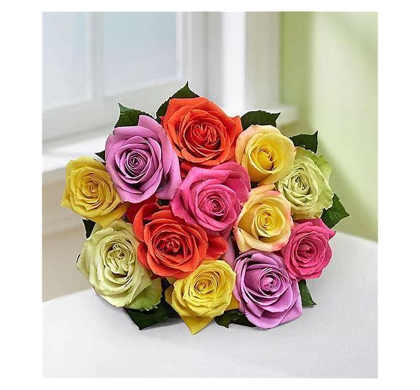 12 pretty mixed roses. An arrangement by Harriet's Flower and Gift Shop.