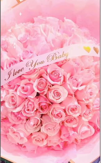 Buchon Roses Wrapped. An arrangement by Geni's Florist and Gifts.