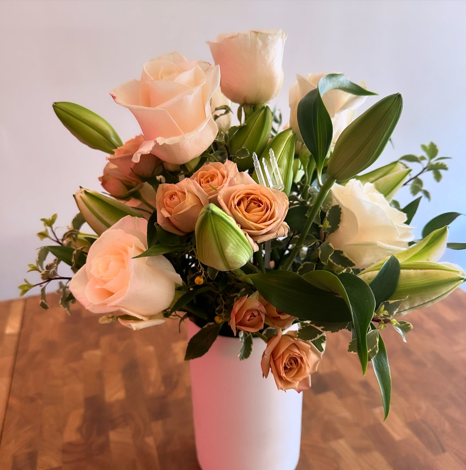 Warm Sentiments (Traditional Vase). An arrangement by The Floral Studio.