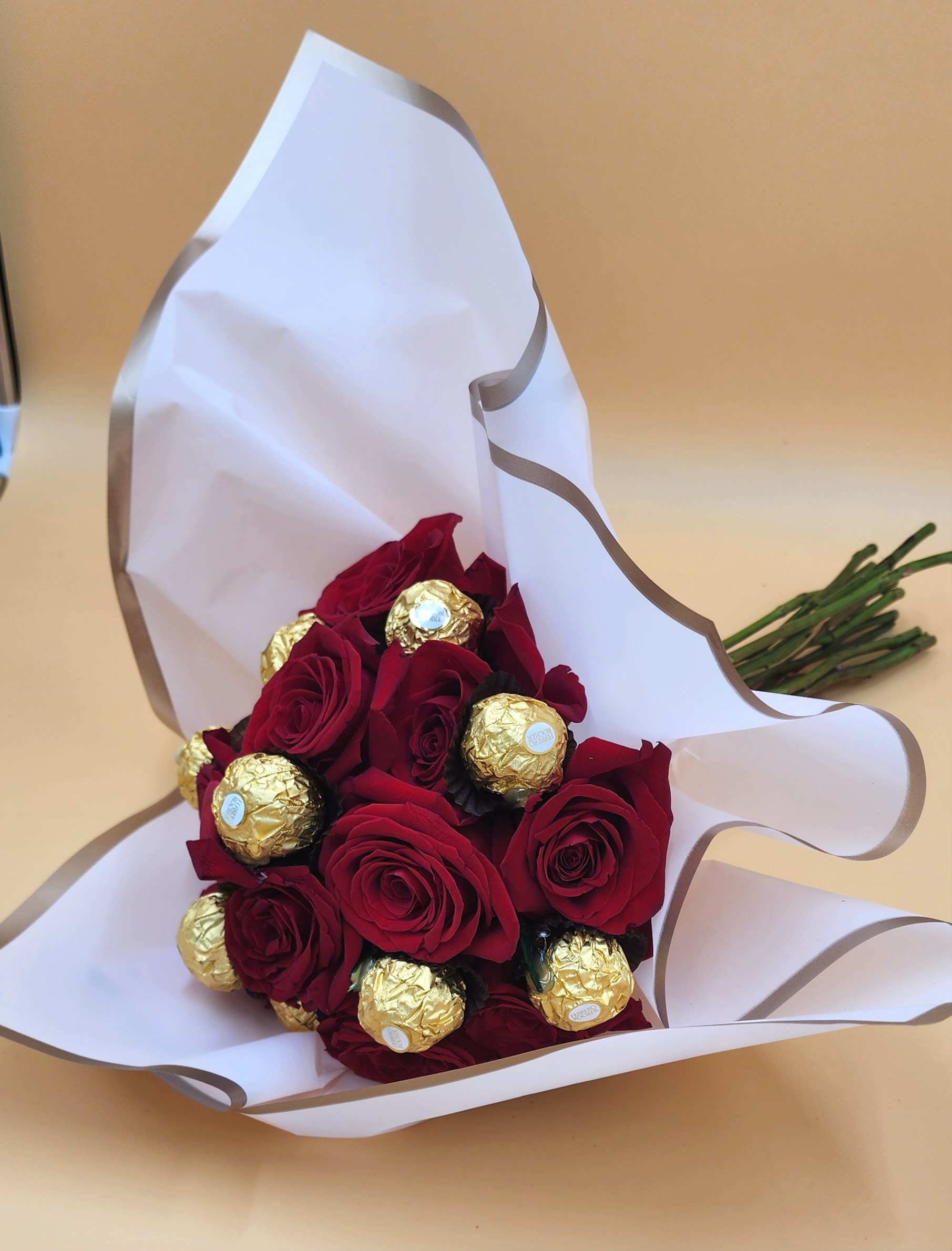 Roses and Ferro. An arrangement by Anne's Flowers and Gifts.