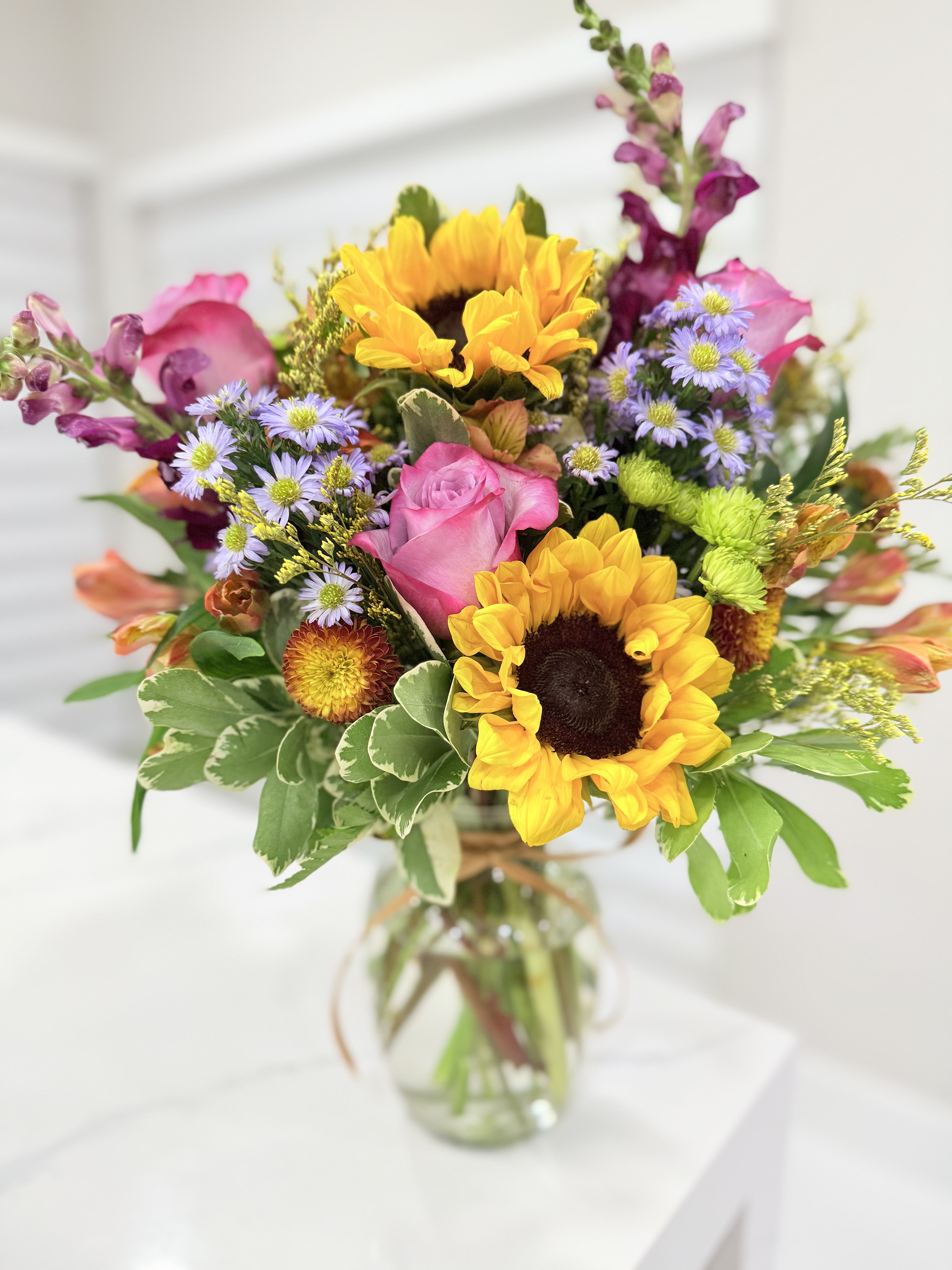 Sunflower and Rose Vase Arrangement. An arrangement by EverBlooming Luxe Designs.