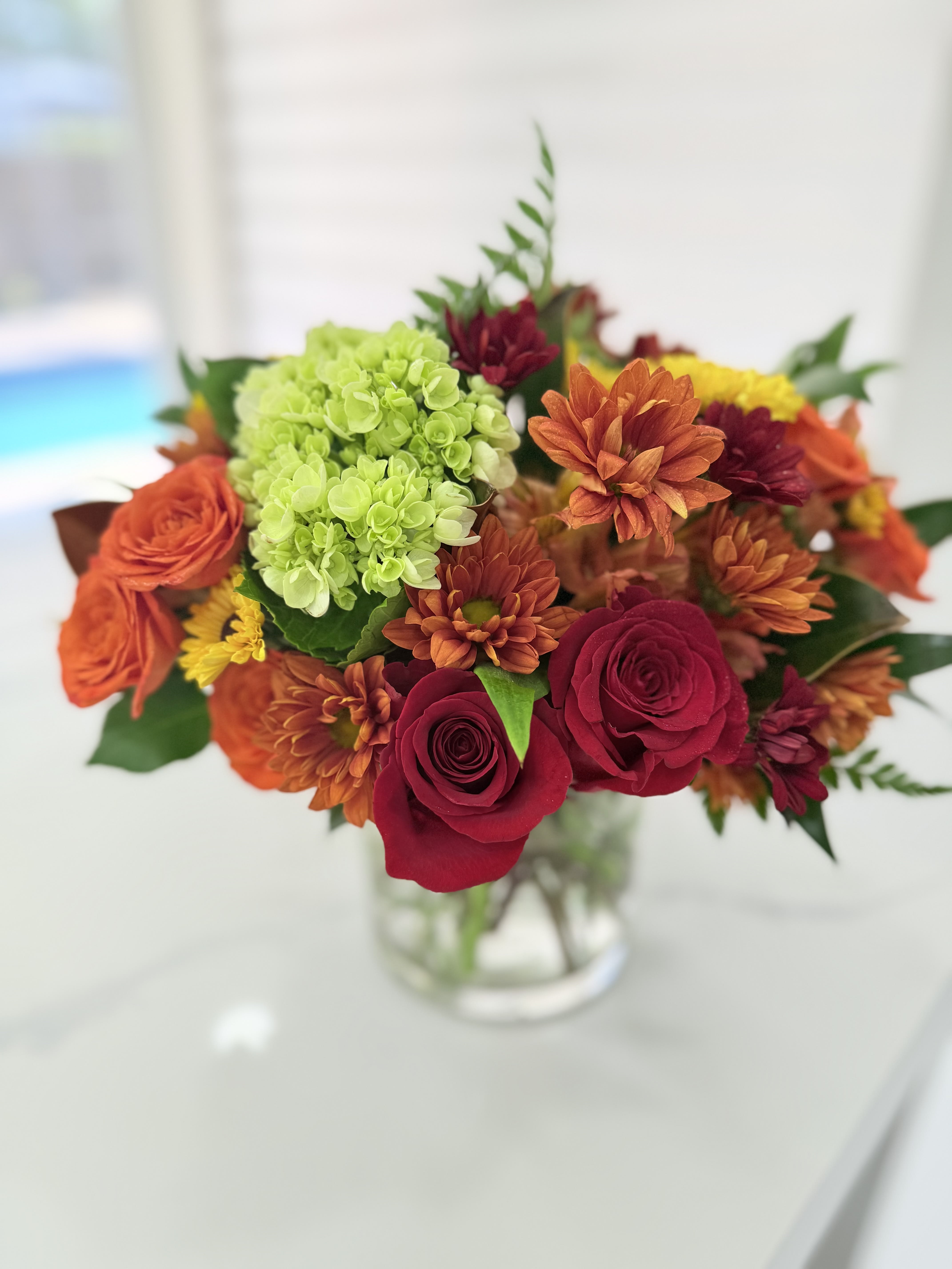 Warm Autumn Mix Vase. An arrangement by EverBlooming Luxe Designs.