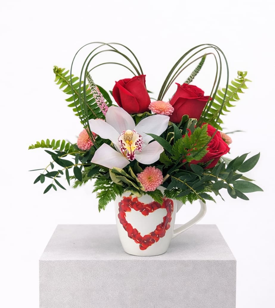 Love in a Mug. An arrangement by The Garden Gate Gifts and Florals.