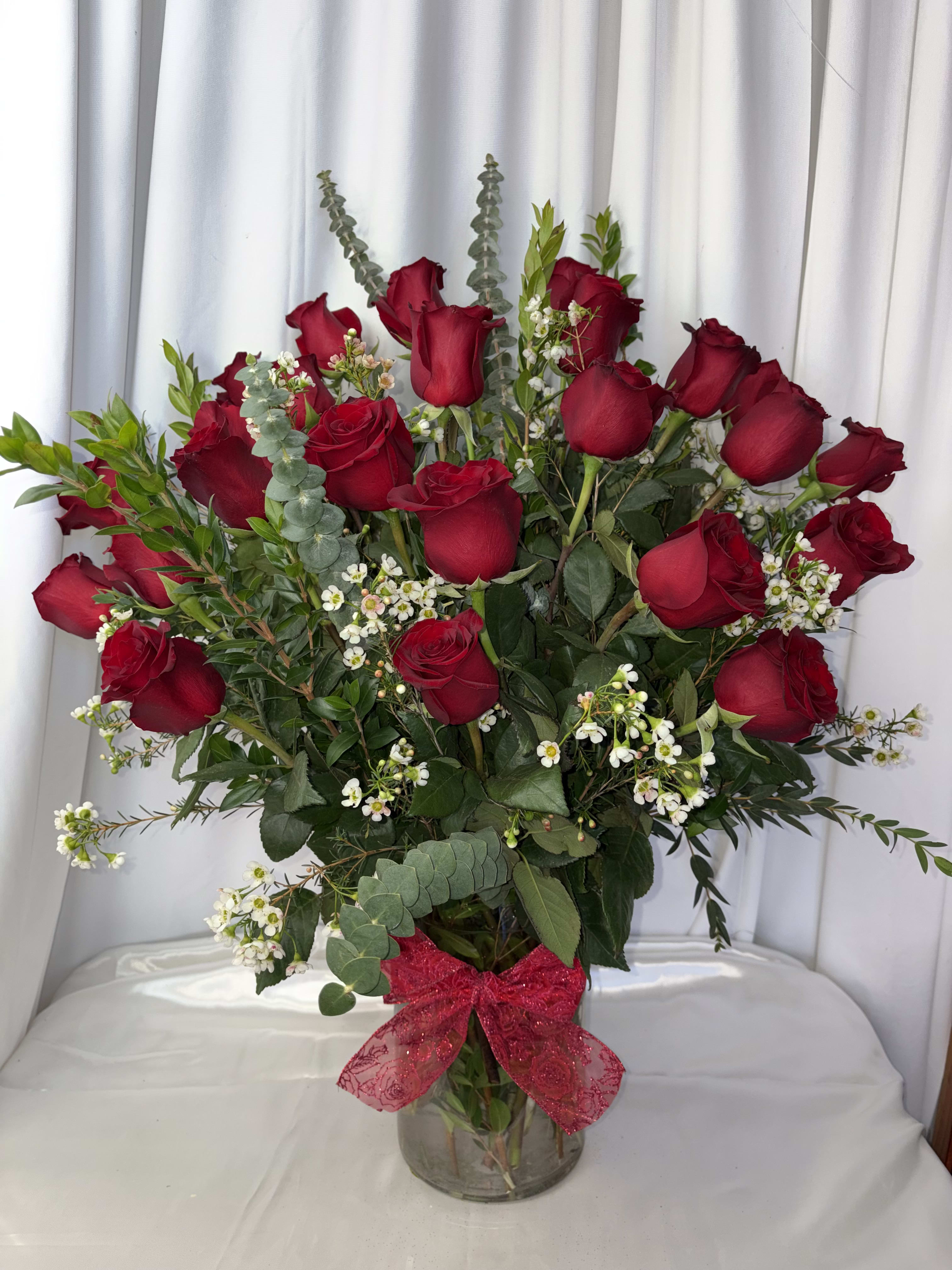 2DZ RED ROSES. An arrangement by M's Flowers.