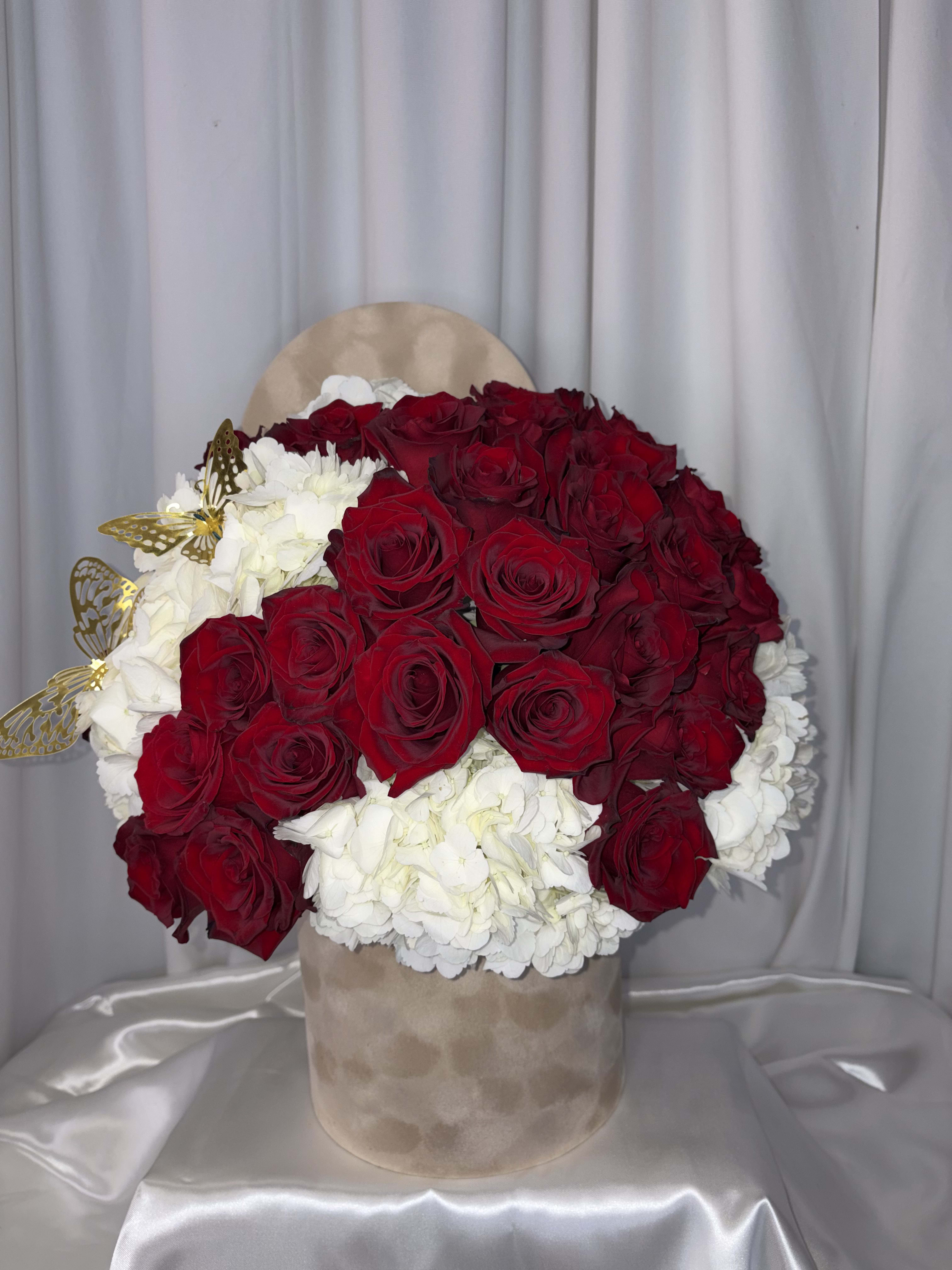 RED VELVET. An arrangement by M's Flowers.