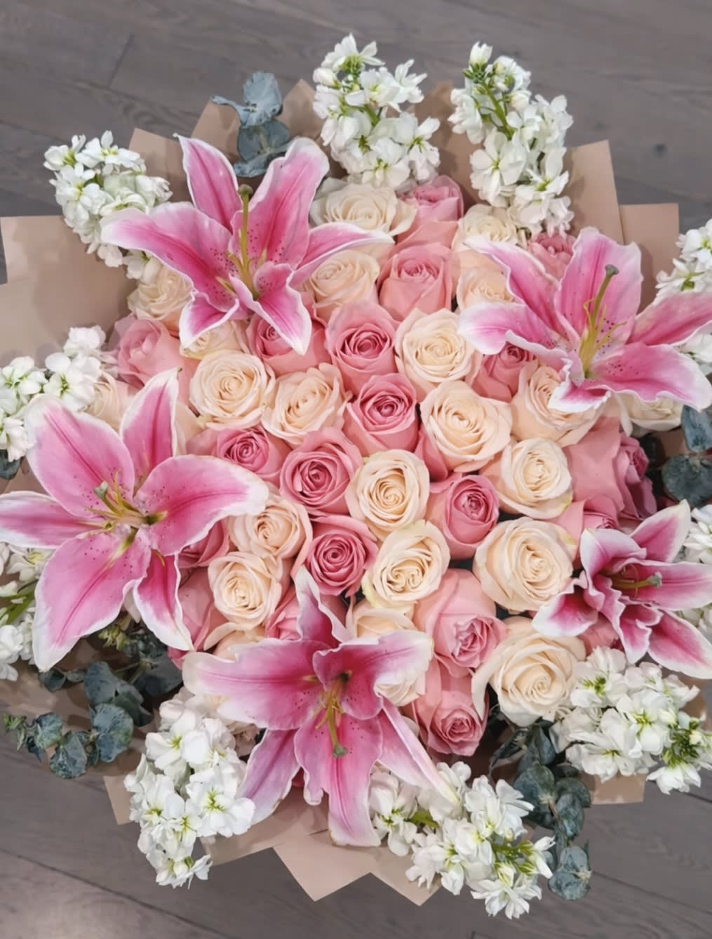 Lily Kissed Romance. An arrangement by Geni's Florist and Gifts.