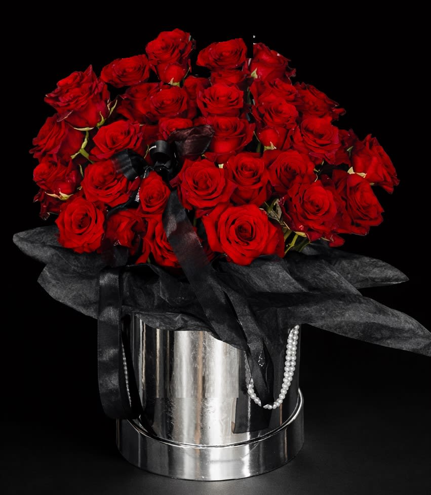 Rich Red Roses Treasure. An arrangement by Geni's Florist and Gifts.