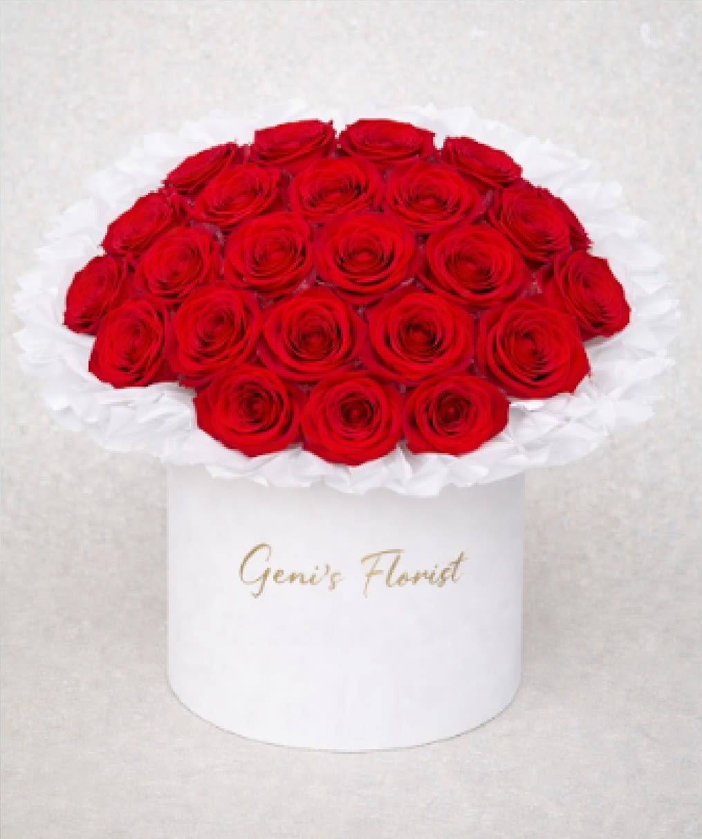 Red Roses in a Box. An arrangement by Geni's Florist and Gifts.