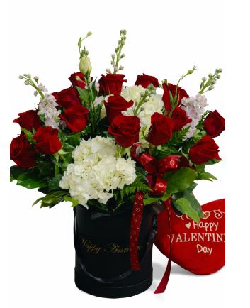 Scarlet and Ivory Embrace. An arrangement by Geni's Florist and Gifts.