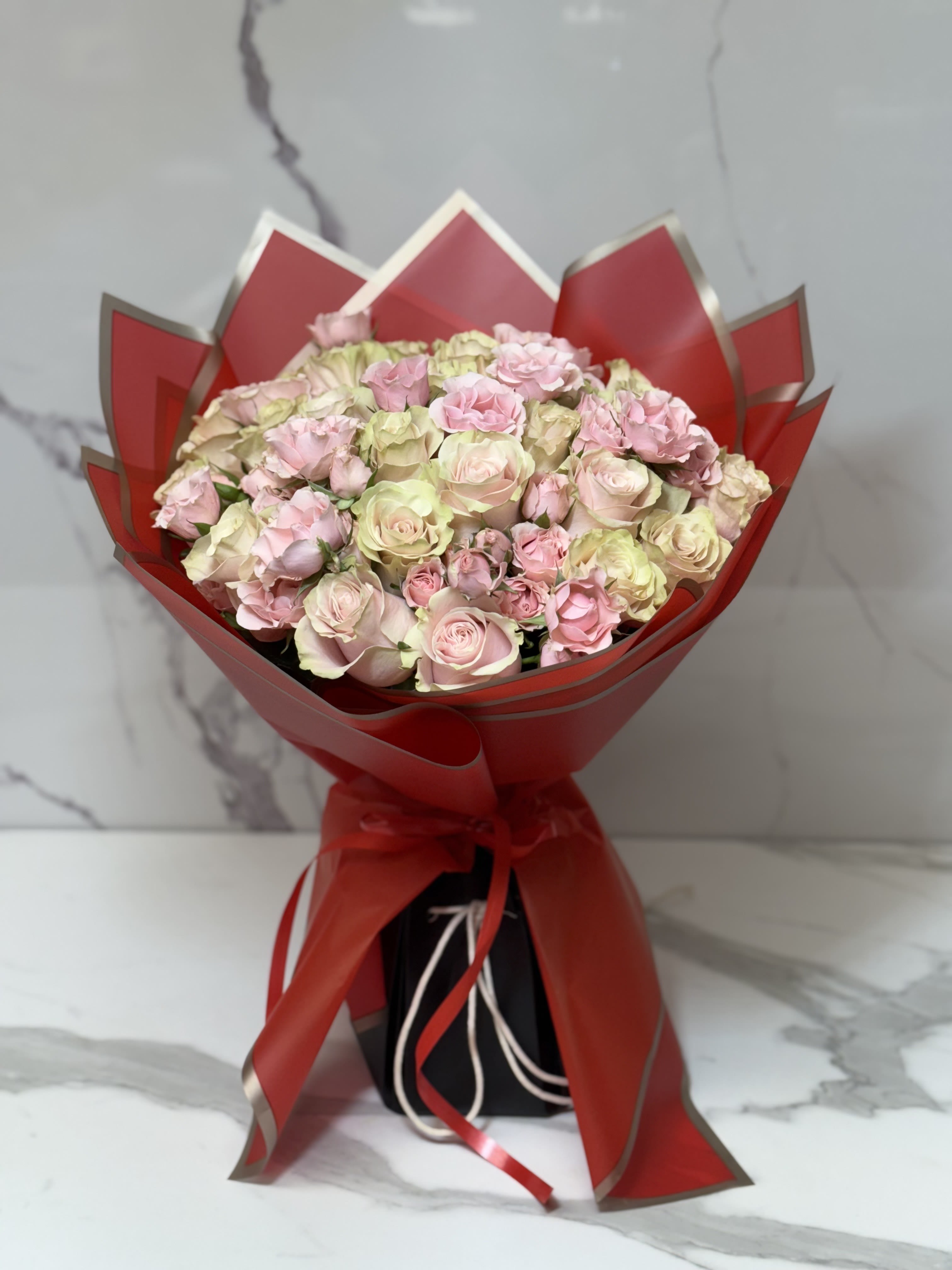 Two Dozen Premium Light Pink Roses. An arrangement by Grower's Flower Market and Gifts.