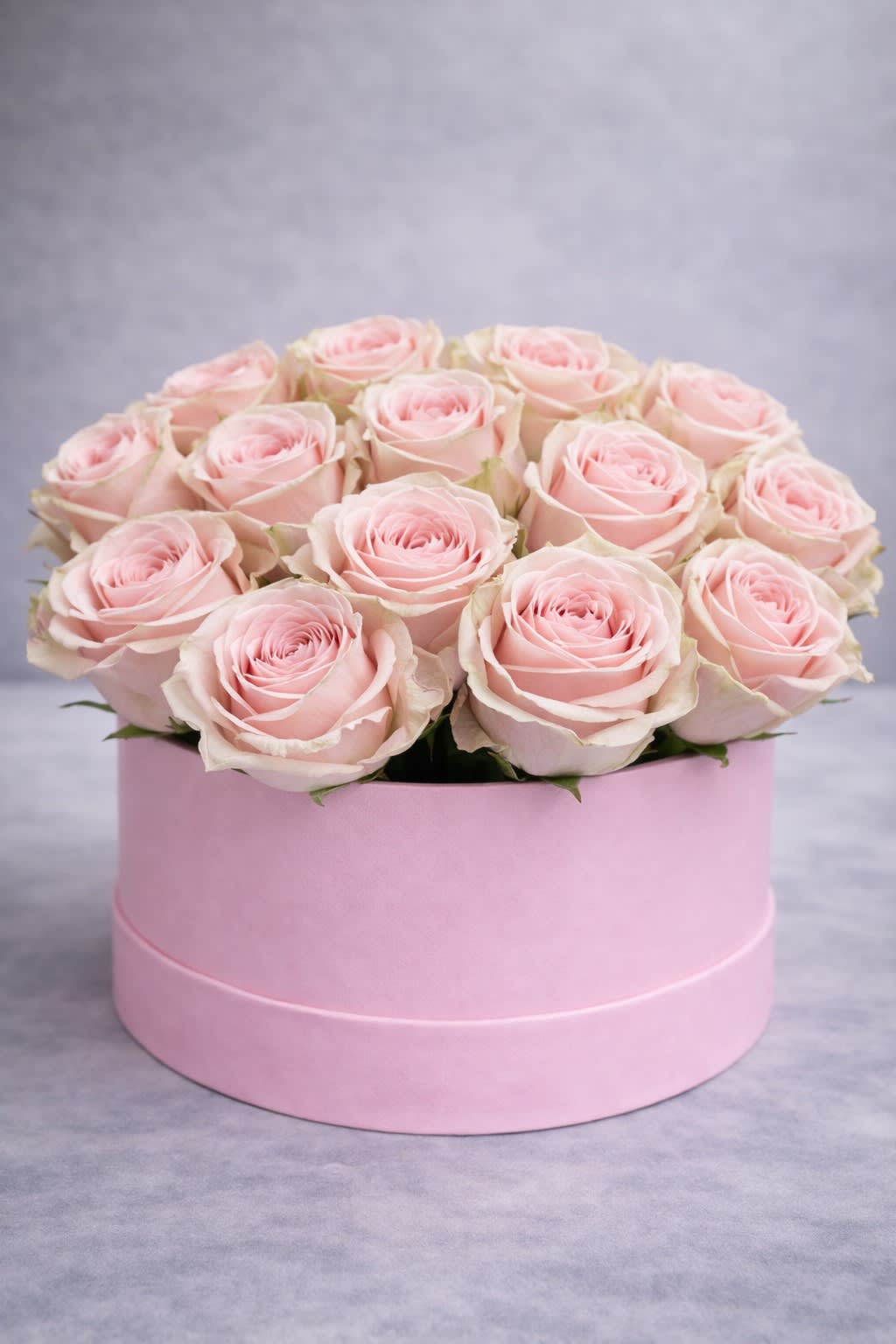 Light Pink roses in box. An arrangement by Grower's Flower Market and Gifts.