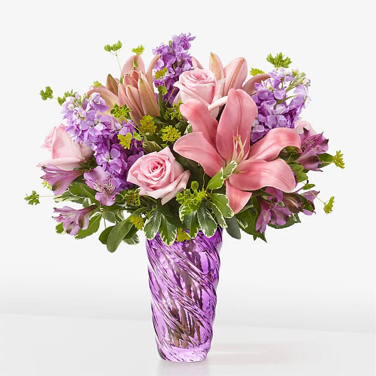 Precious Petals Bouquet with Luxe Swirl Vase. An arrangement by Serrano Flowers.