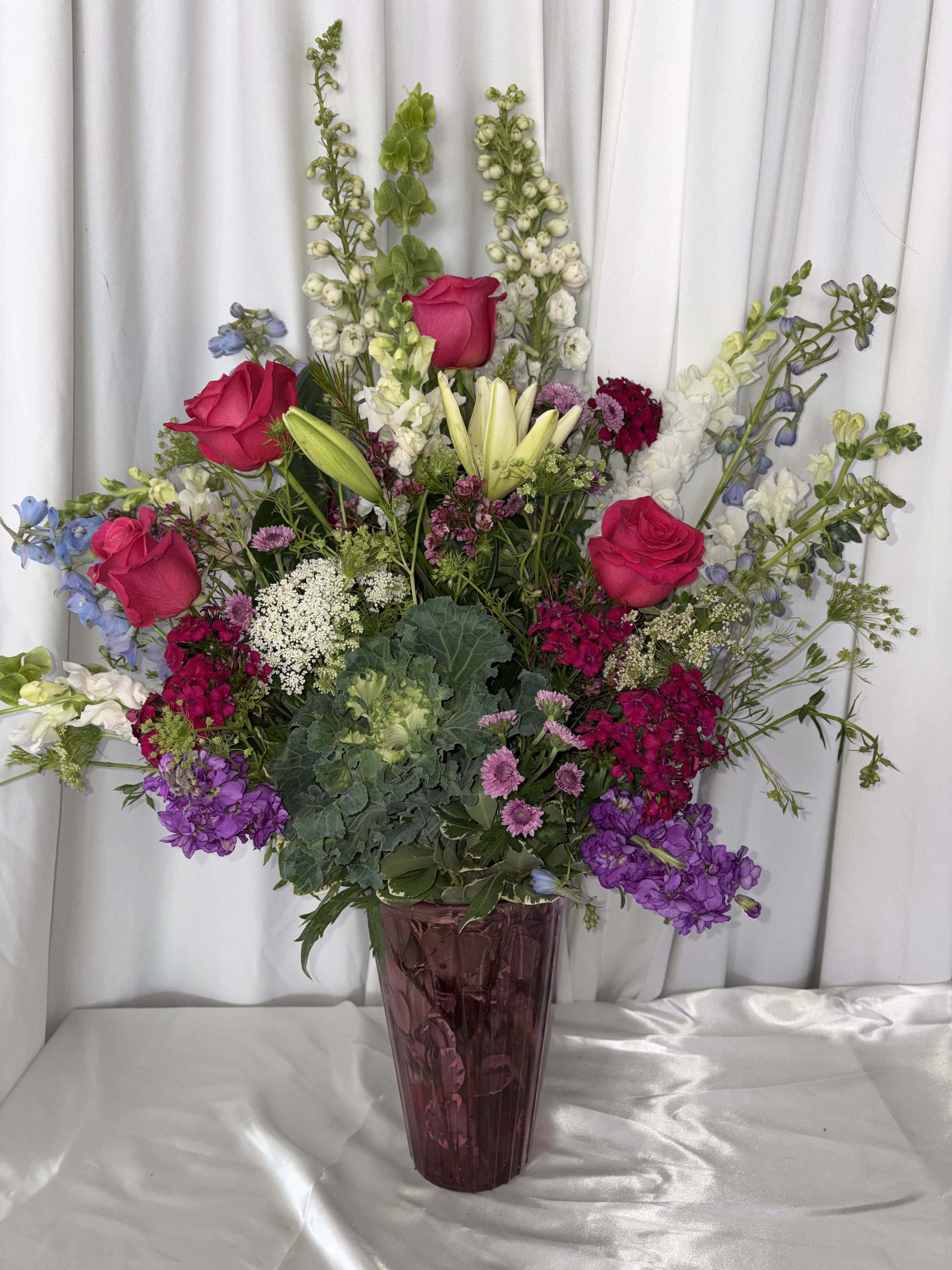 GARDEN PERFECTION. An arrangement by M's Flowers.