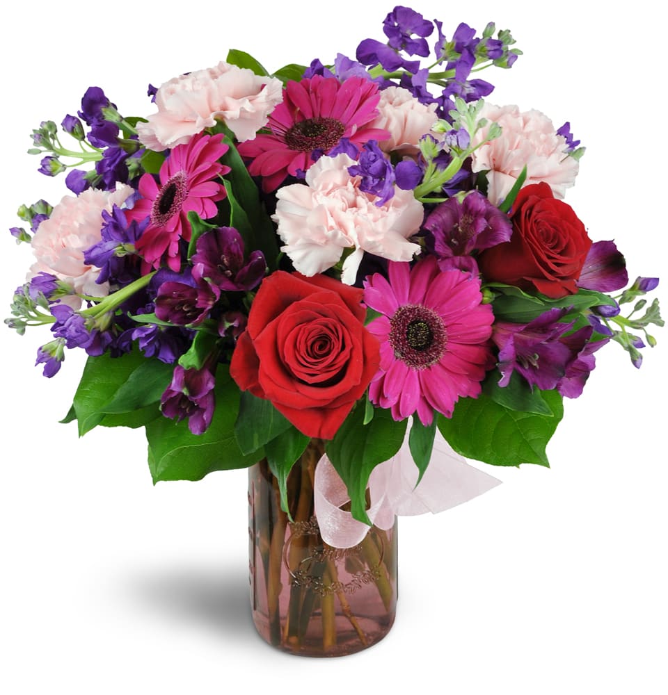 My One and Only™. An arrangement by Merritt Florist. Featuring bright pink mini gerbera daisies, delicate pink carnations, purple Peruvian lilies,...