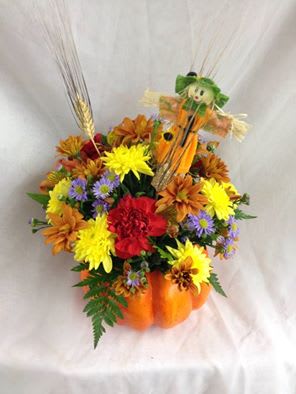 Harvest Pumpkin Centerpiece. An arrangement by Vaillant Florist.