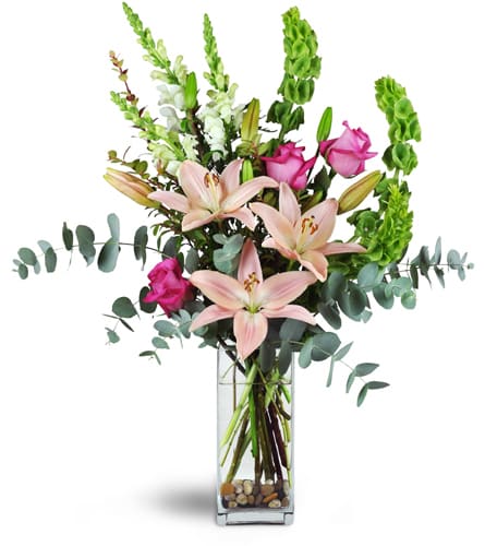 Sweet Pink Romance™. An arrangement by Gardenfairy Florist. Fuchsia roses, pink Asiatic lilies, snapdragons, and bells of Ireland are sweetly...