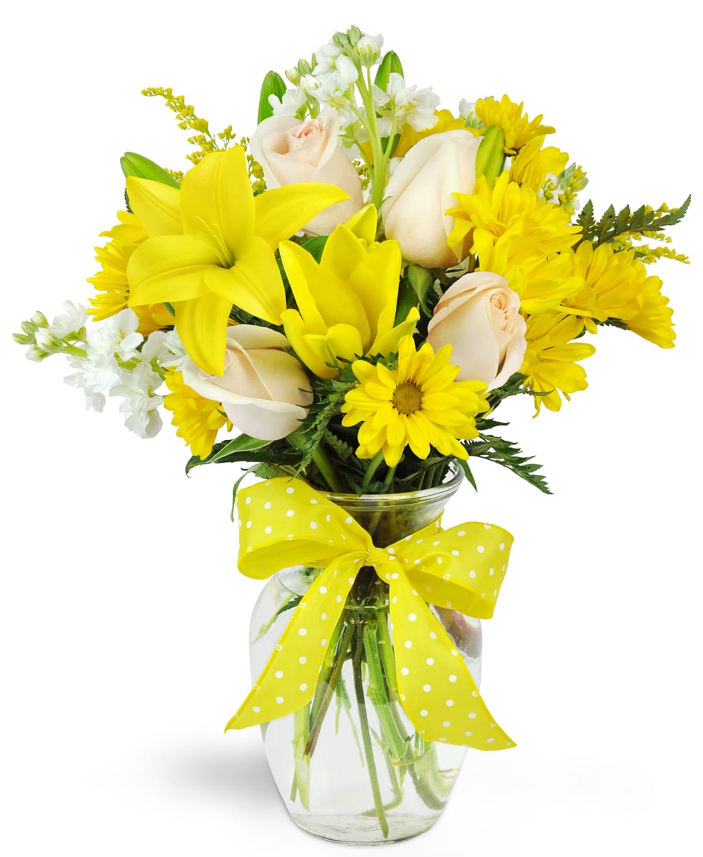 Smile a Mile Daisy Vase™. An arrangement by Lori's Hearts and Flowers. Yellow lilies and daisies are arranged with cream roses and topped off with...
