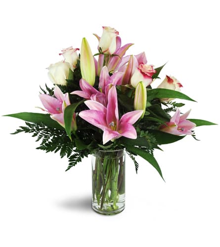 Alluring Roses and Lilies™. An arrangement by Dublin Floral Company. A sweet assortment of pink lilies and roses are arranged in a glass cylinder...