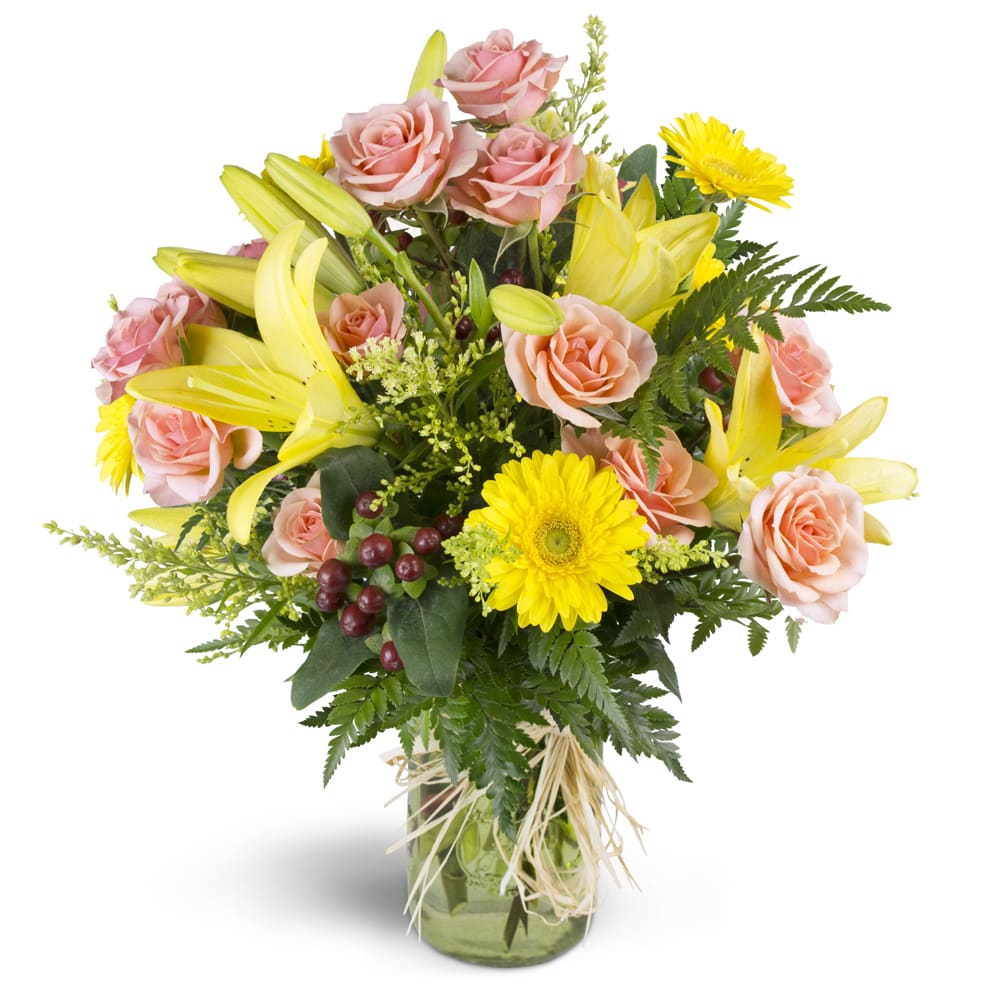 Sweet and Sunny™. An arrangement by Nana's Flower Shop and Gifts. Soft pink spray roses and bright yellow mini Gerbera daisies are cheerfully...