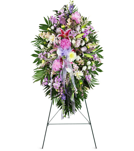 Tender Sentiments Lily Spray™. An arrangement by YSD Events and Flowers. This standing spray features a comforting assortment of lilies, peonies,...