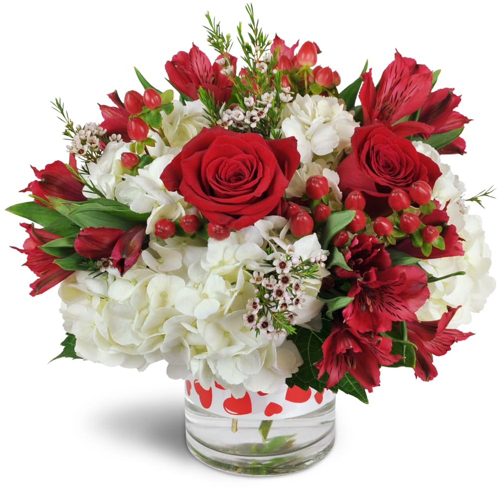 You're the One™. An arrangement by Kuchie's Alpine Florist. White hydrangea and red Peruvian lilies are accented with waxflower, ribbon, and more....