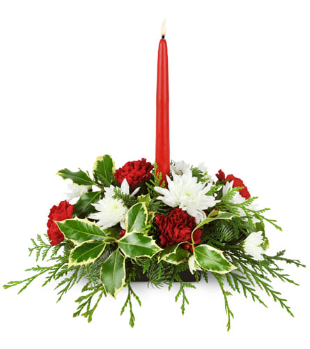 Truly Christmas™. An arrangement by Just Roses Flowers and More. Red carnations, white mums, and fragrant greens are arranged with a red tapered...