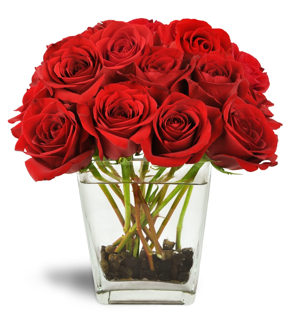 Love's Destiny Bouquet™. An arrangement by Langdon Florist of Tribeca. Large red rose blooms burst from a clear glass vase lined with river rocks..