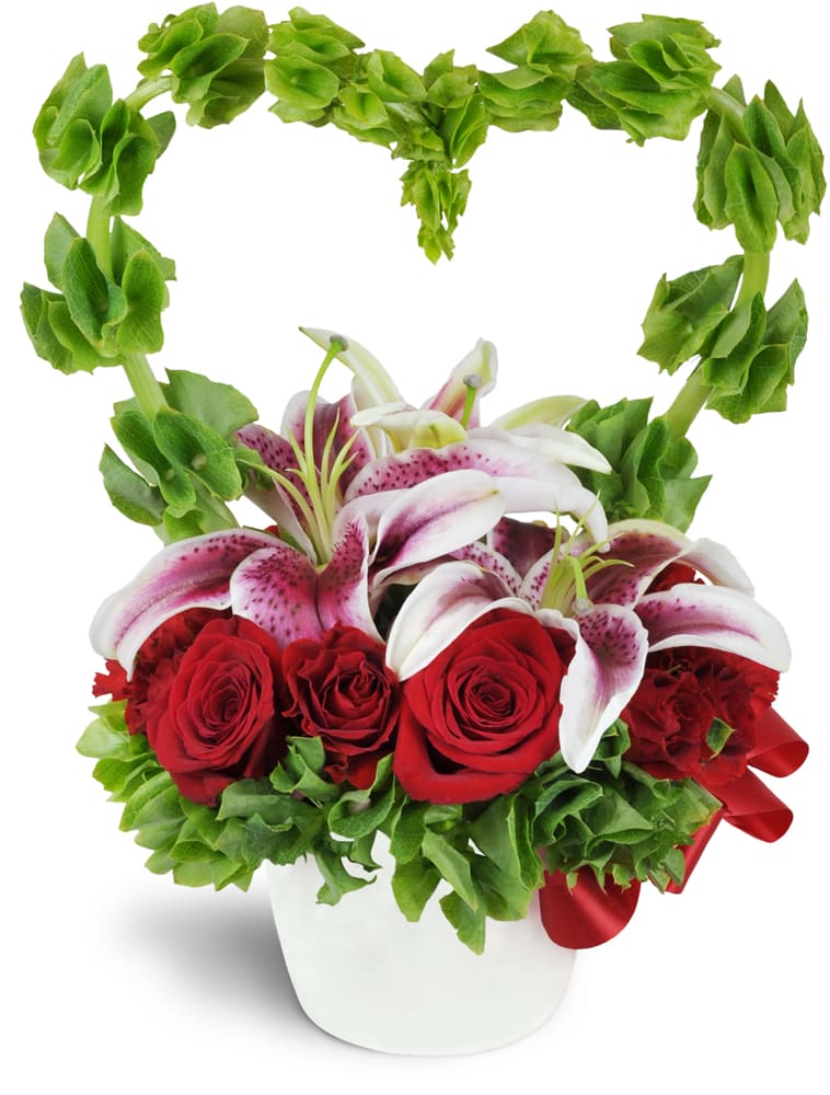 My Love Grows™ Bouquet. An arrangement by Sweet Blossoms. Stargazer lilies are encircled by a romantic heart-shaped arc of Bells of Ireland and...