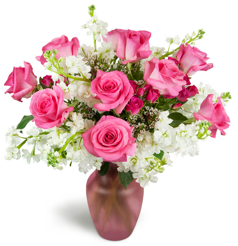 Sweet on You Bouquet™. An arrangement by Midtown Florist. Hot pink roses are arranged with delicate white stock and charming spray roses..
