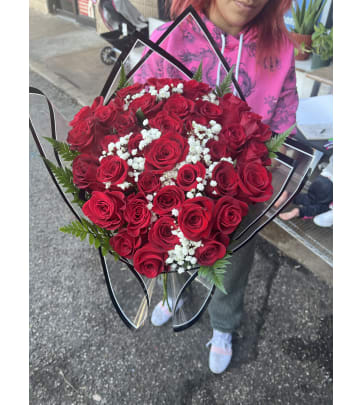 48 stems red rose wrap with color paper in Sharpstown, TX - TOP FLORIST