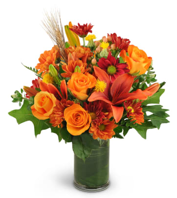 Orange Floral Arrangement On Table by Stocksy Contributor Vicki Grafton  Photography - Stocksy