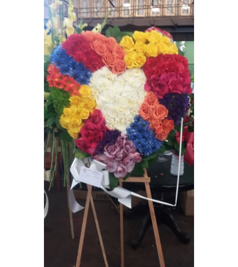 My Rainbow heart. An arrangement by Commerce Flowers.