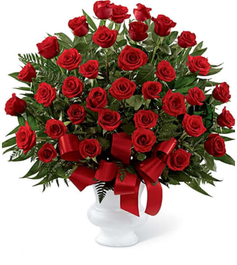 Touch of Sympathy. An arrangement by Seasons Change Designs.