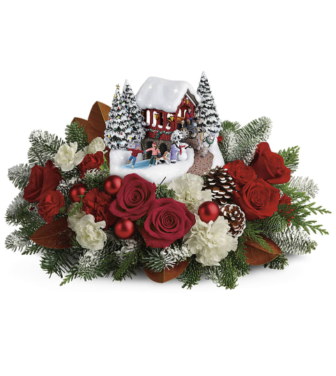 Kinkade's Snow Fall Dreams. An arrangement by A Touch of Class Flowers and Drapery.