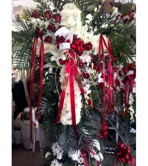 cross of faith. An arrangement by Howard Beach Florist.