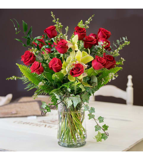 Roses and Orchids. An arrangement by Loyalist Flowers.