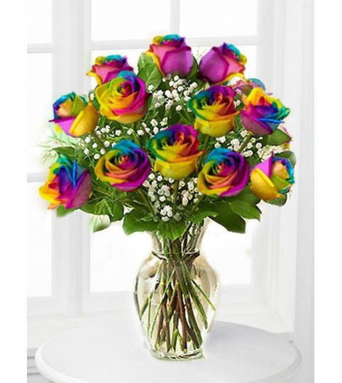 Ready to celebrate ! Rainbow Roses Style. An arrangement by Triple A Florist.