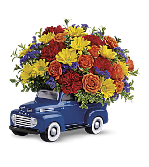 Ford Pickup Full Of Flowers. An arrangement by K1 Floral Studio.