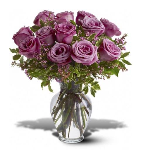 1 DOZEN PURPLE ROSES IN VASE WITH GREENS AND FILLER