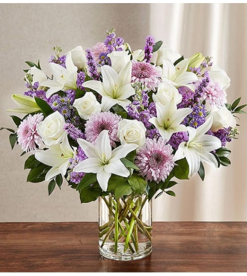 SINCEREST SORROW IN PURPLE. An arrangement by J.D. Ballantine's Flowers and Gifts.