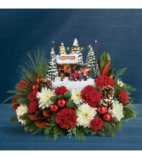 We are here for Christmas. An arrangement by Triple A Florist.