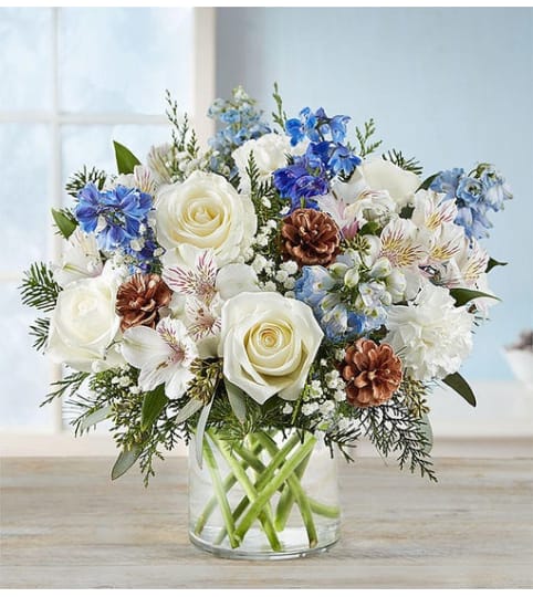 WINTER FILLED WISHES. An arrangement by J.D. Ballantine's Flowers and Gifts.