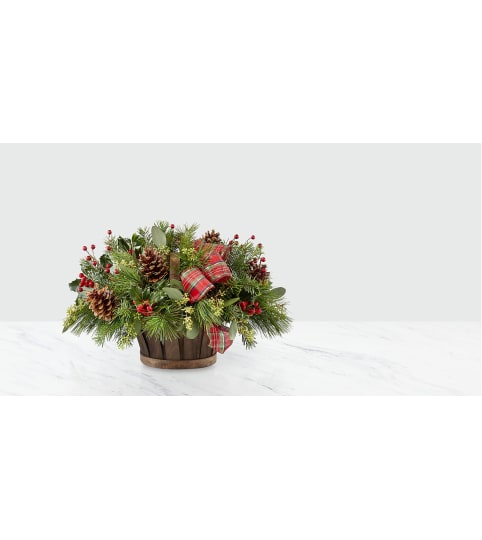 WINTER GREENS BASKET. An arrangement by J.D. Ballantine's Flowers and Gifts.