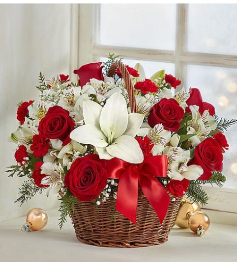 The Fields of Europe™ Christmas Basket. An arrangement by Butterflies Flower Shop.