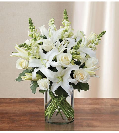 The Classic All White Arrangement™. An arrangement by Butterflies Flower Shop.