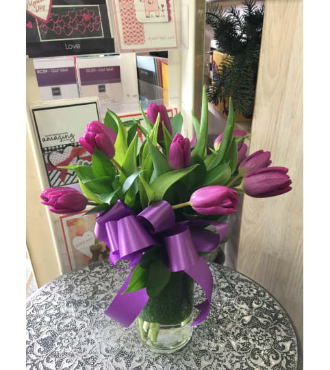 Purple Tulips in clear vase by Vivian