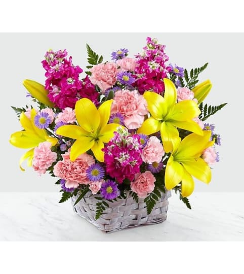 bright sunny lights. An arrangement by Geni's Florist and Gifts.