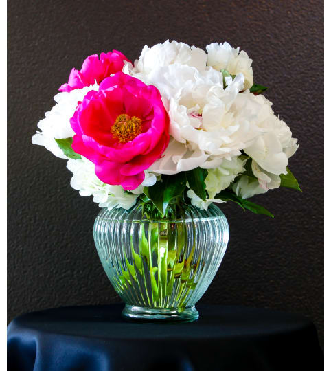 Royal Peonies exclusive. An arrangement by Florist of the Northwoods.