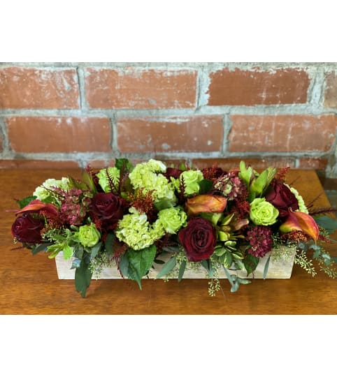 MAGNIFICENT FALL CENTERPIECE. An arrangement by J.D. Ballantine's Flowers and Gifts.