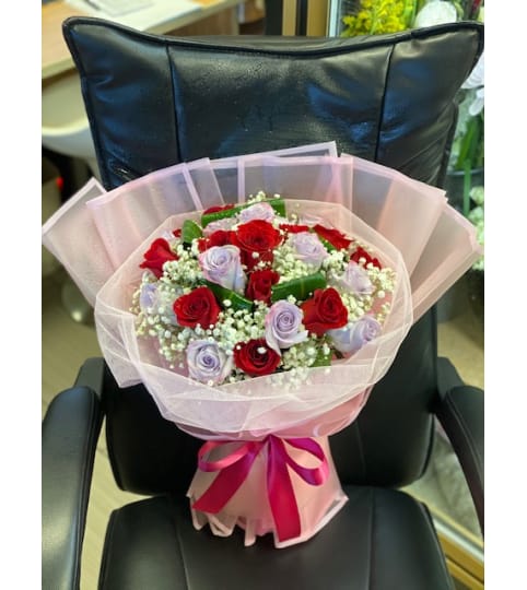 Trendy Rose Bouquet. An arrangement by Flamingo Floral and Gifts.